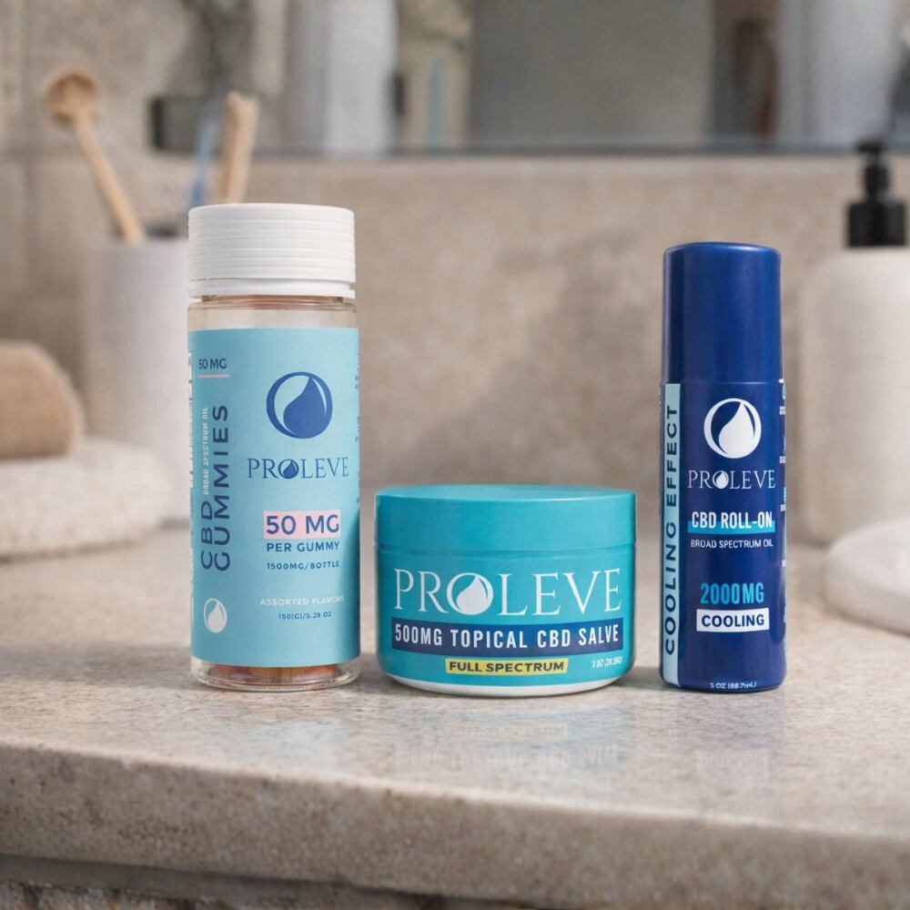 PROLEVE CBD Hero Pain Relief Bundle products including gummies, salve, and roll-on on a bathroom counter.