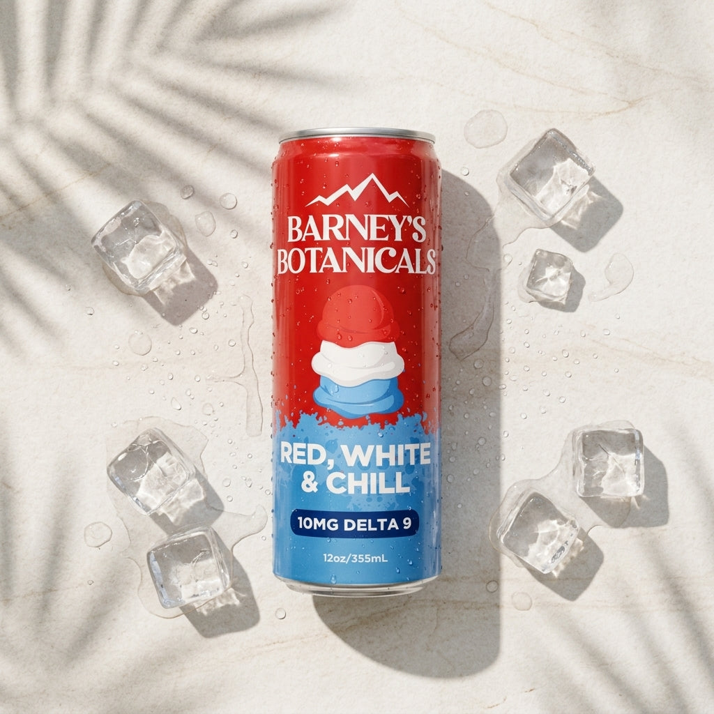Red can of Barney's Botanicals with blue label on a light background with ice cubes